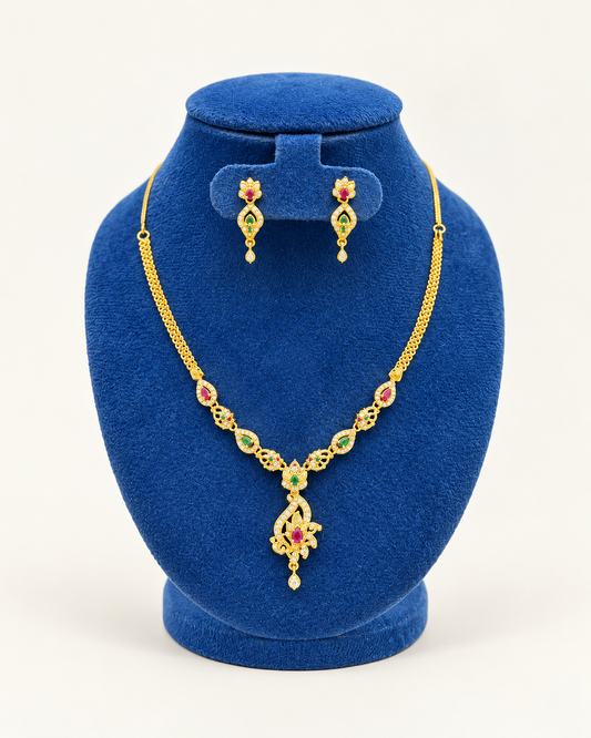 Kaveri paisley pendant stone necklace set with earrings in multicolor on a blue velvet display stand